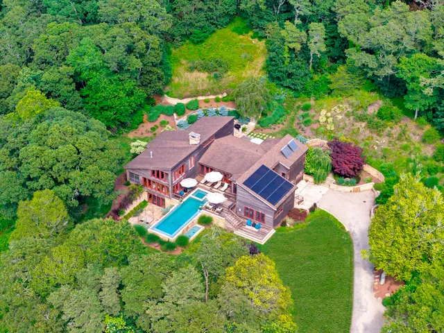 an aerial view of a house with a garden