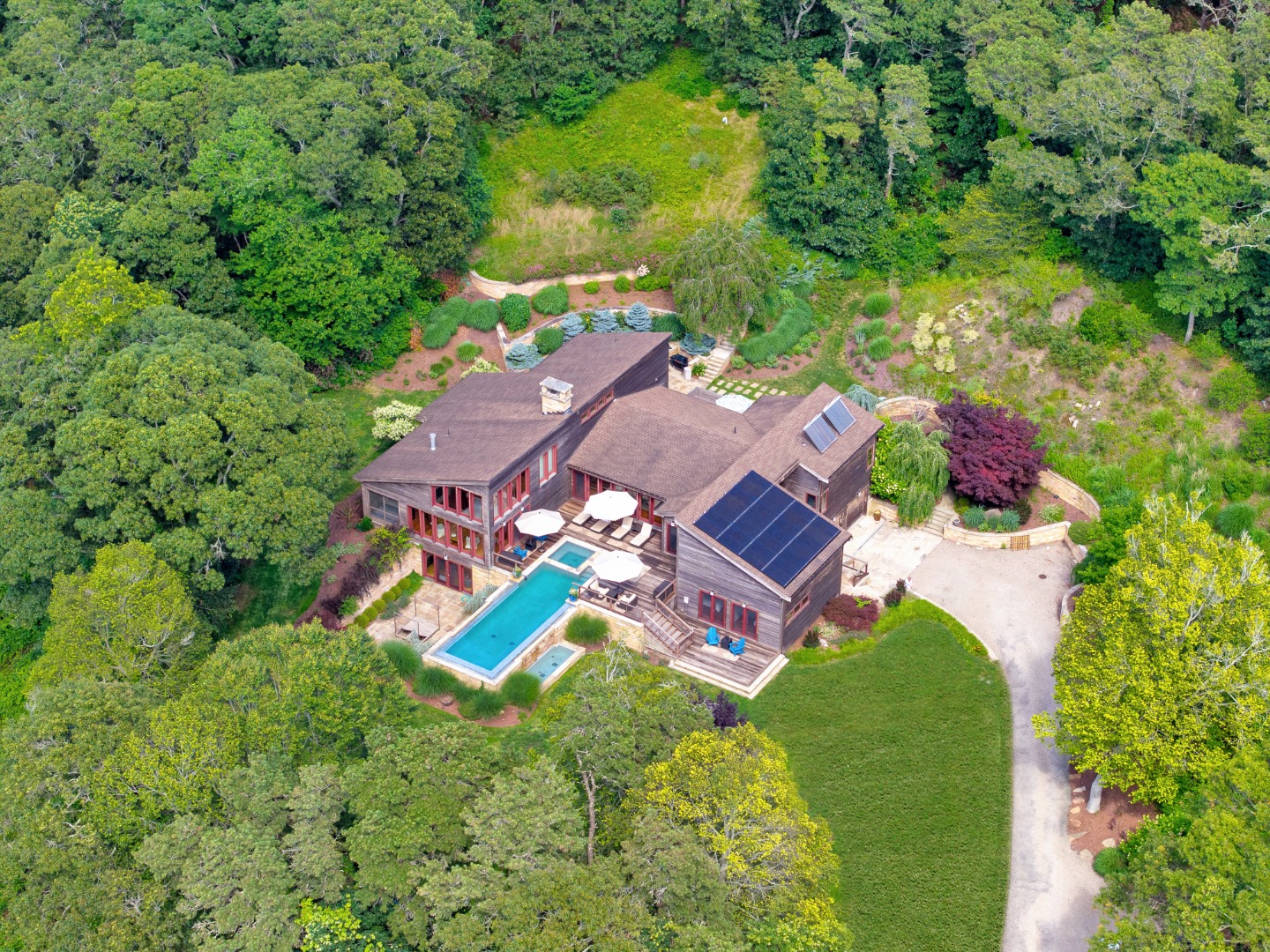 400 Barnes Road Oak Bluffs, MA 02568 - Photo 2 of 45 an aerial view of a house with a garden