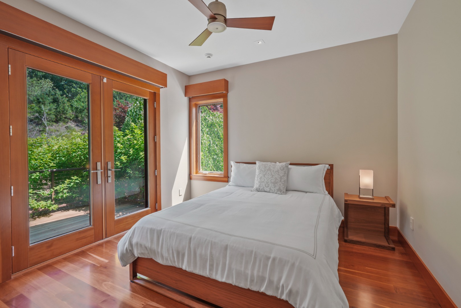 400 Barnes Road Oak Bluffs, MA 02568 - Photo 26 of 45 a bed sitting in a bedroom next to a window