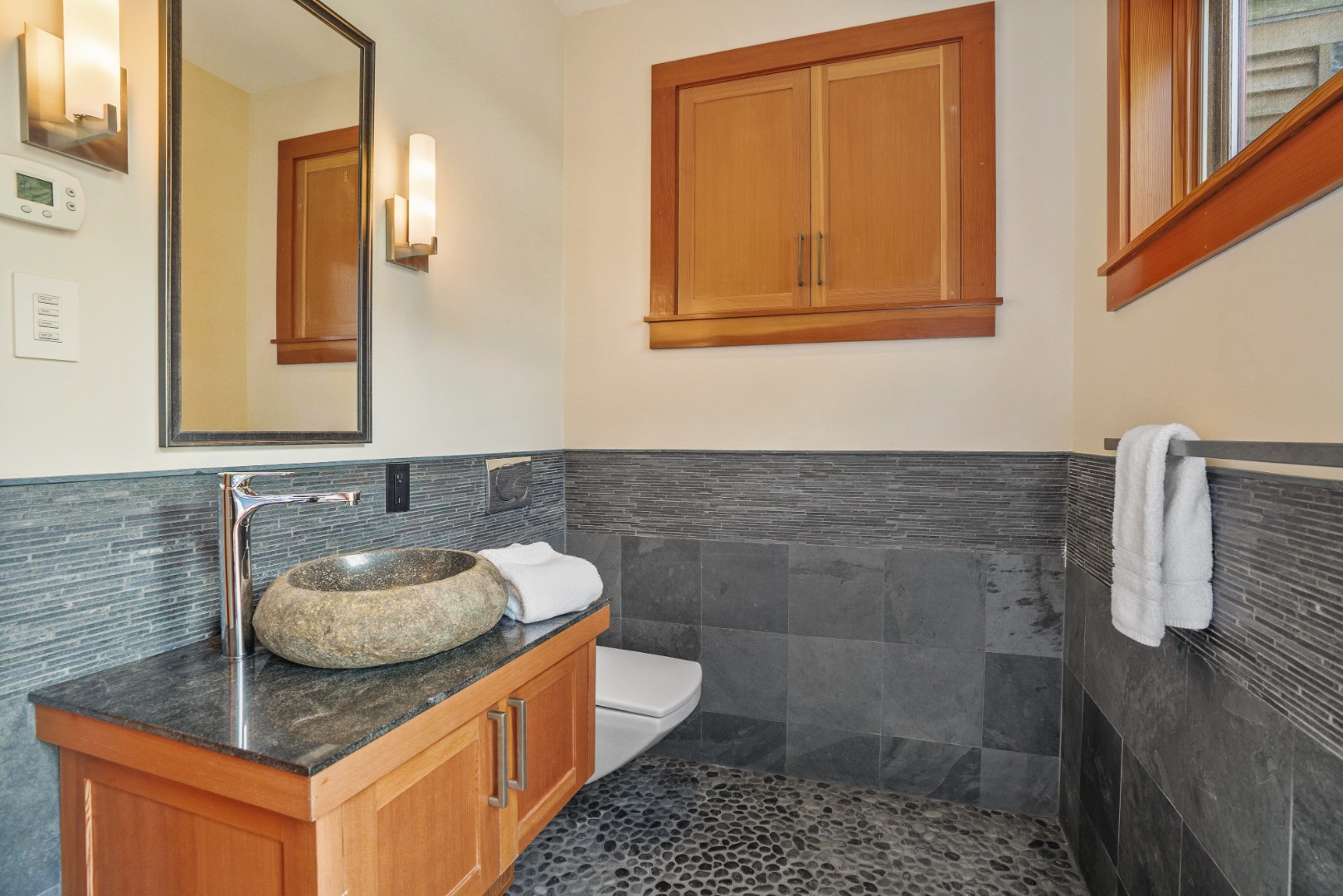400 Barnes Road Oak Bluffs, MA 02568 - Photo 29 of 45 a bathroom with a sink a toilet and mirror