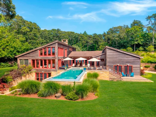 a front view of house with yard and green space