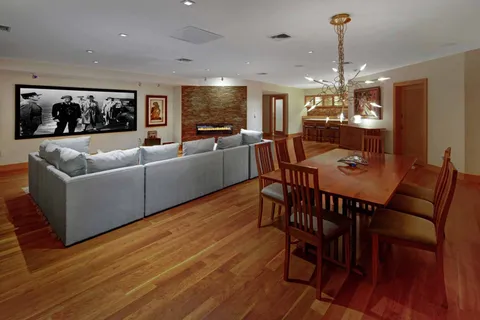 a view of a dining room with furniture window and wooden floor
