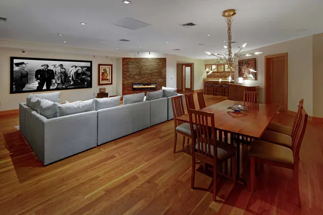 a view of a dining room with furniture window and wooden floor