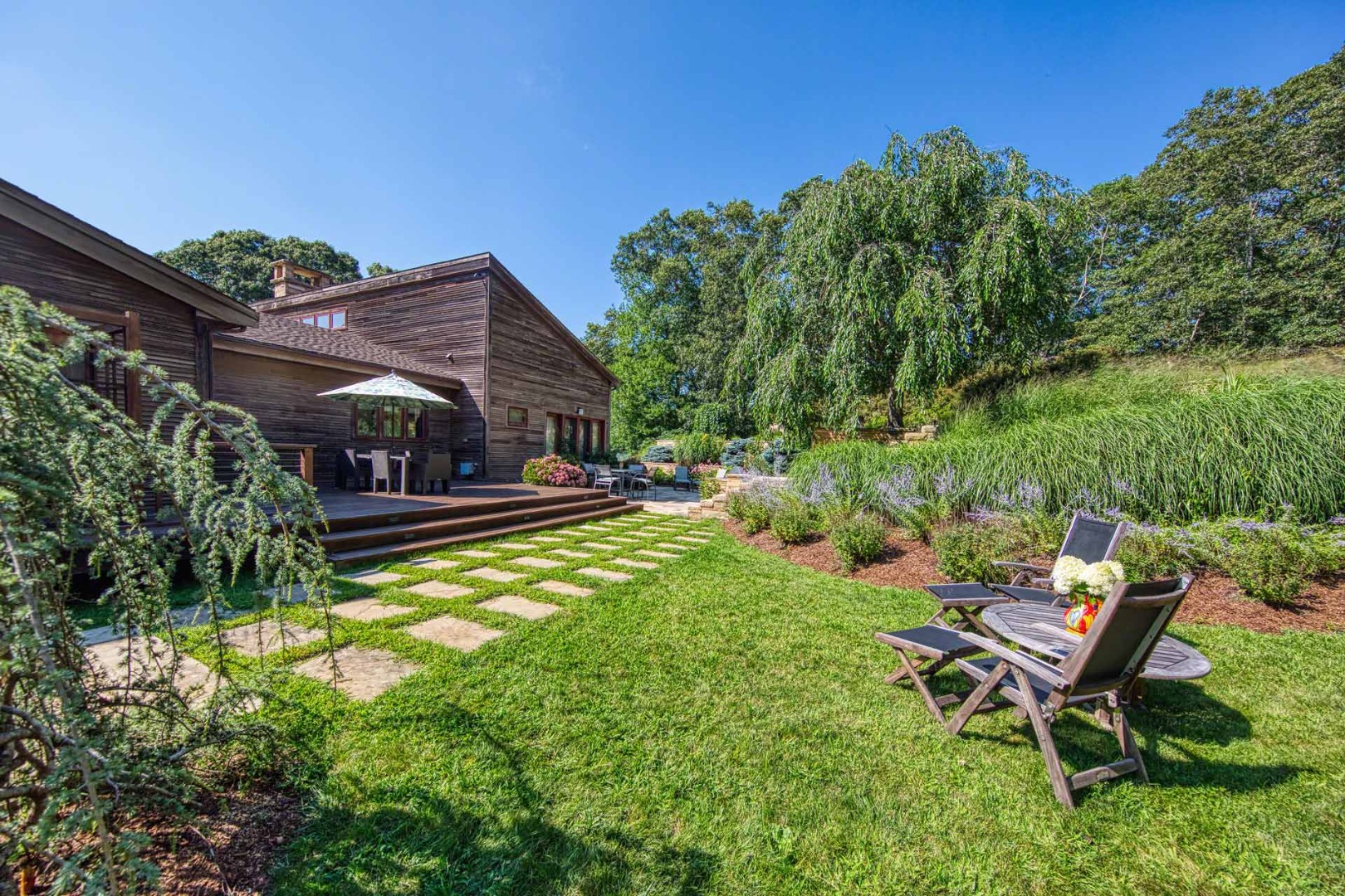 400 Barnes Road Oak Bluffs, MA 02568 - Photo 42 of 45 a view of a backyard with sitting area