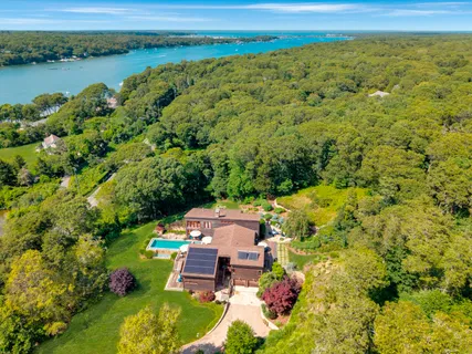 an aerial view of a house with a lake view
