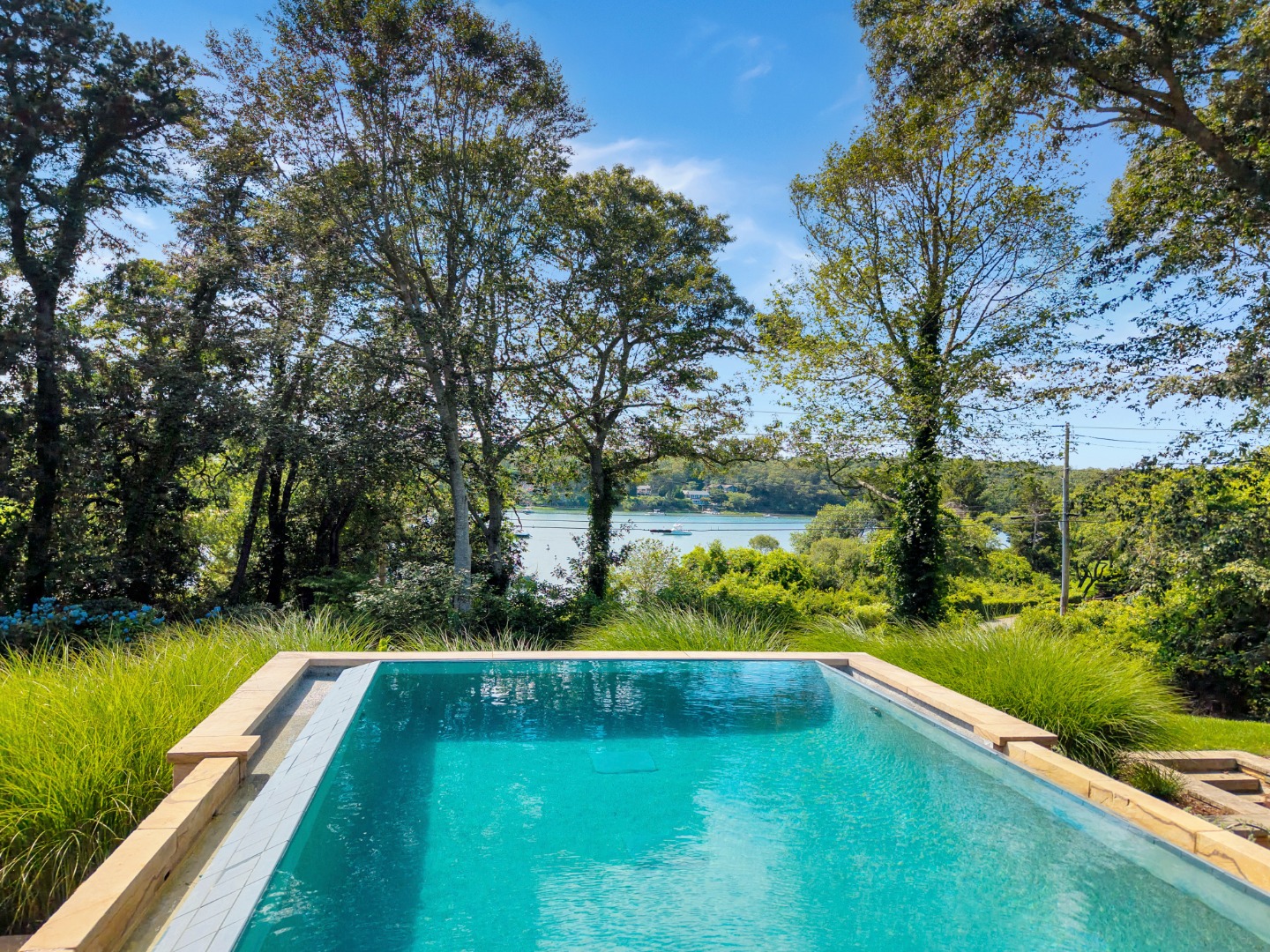 400 Barnes Road Oak Bluffs, MA 02568 - Photo 5 of 45 a view of swimming pool from a balcony