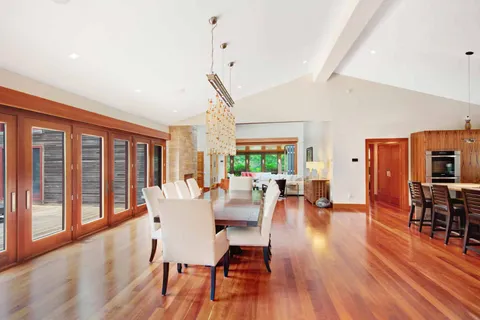 a dining room with furniture window wooden floor