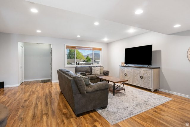 41 Benchmark Village Tooele, UT 84074 - Photo 3 of 26 Living room featuring light wood-type flooring and recessed lighting