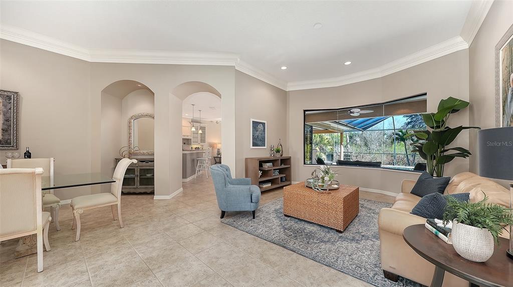 664 Crane Prairie Way Osprey, FL 34229 - Photo 11 of 69 a living room with furniture and a large window