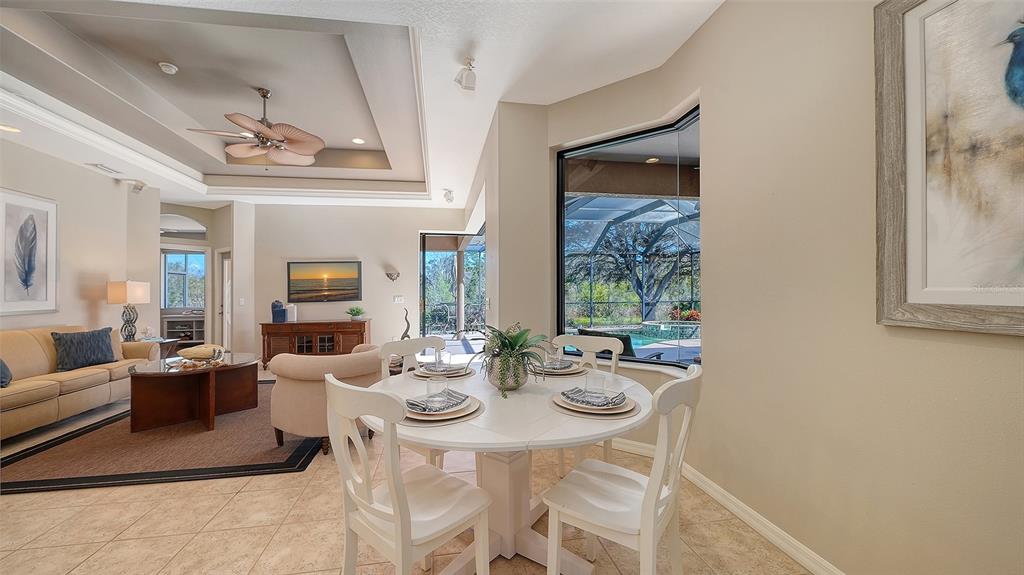 664 Crane Prairie Way Osprey, FL 34229 - Photo 18 of 69 a view of a dining room with furniture window and outside view