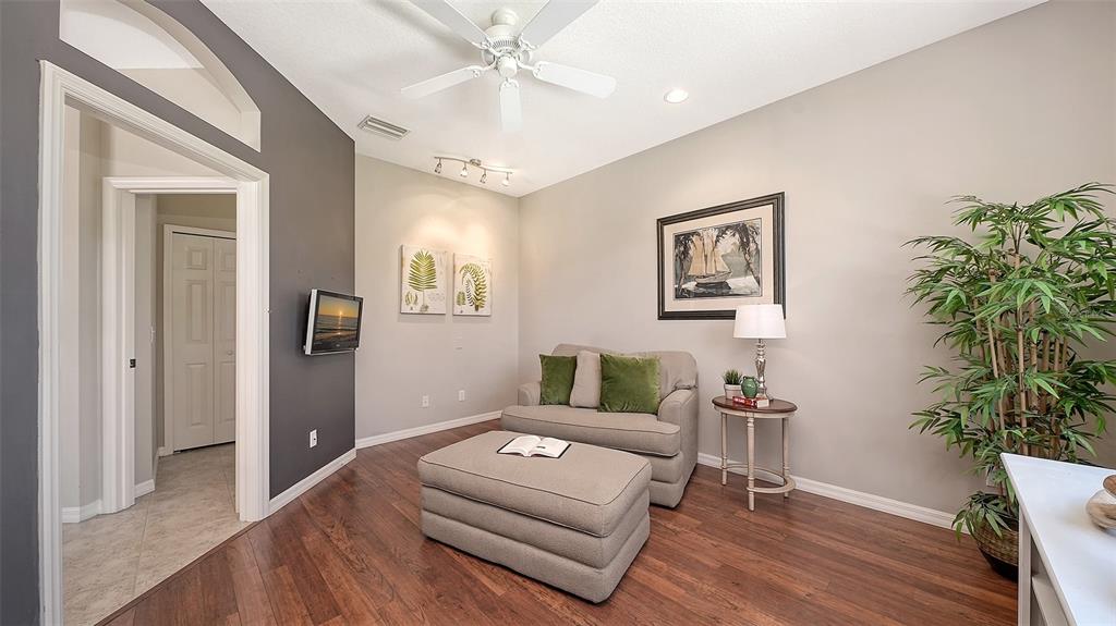 664 Crane Prairie Way Osprey, FL 34229 - Photo 23 of 69 a living room with furniture and a potted plant