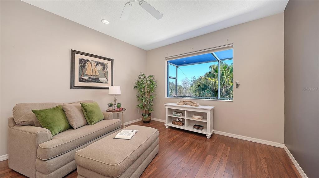 664 Crane Prairie Way Osprey, FL 34229 - Photo 25 of 69 a living room with furniture and a window