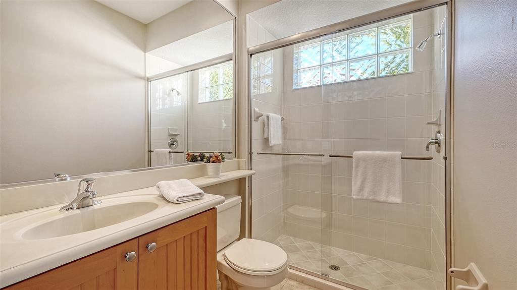664 Crane Prairie Way Osprey, FL 34229 - Photo 26 of 69 a bathroom with a sink toilet and shower