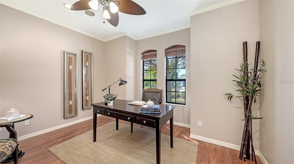 664 Crane Prairie Way Osprey, FL 34229 - Photo 27 of 69 a living room with furniture and a potted plant