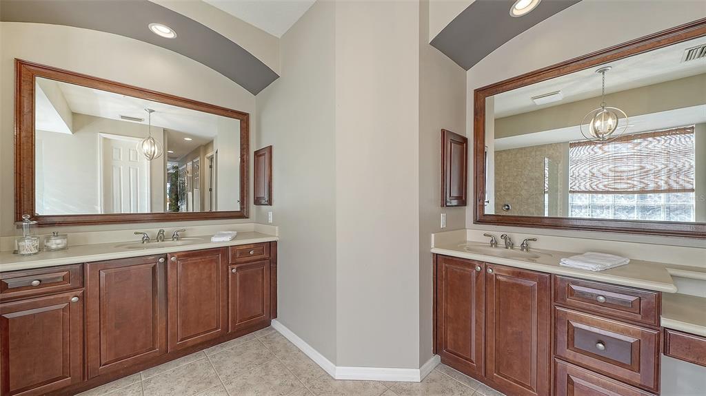664 Crane Prairie Way Osprey, FL 34229 - Photo 36 of 69 a bathroom with a granite countertop sink and a mirror