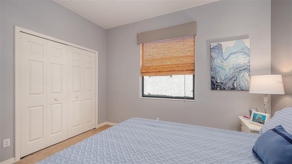 664 Crane Prairie Way Osprey, FL 34229 - Photo 41 of 69 a bedroom with a bed and a window