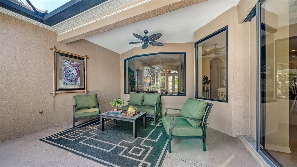 664 Crane Prairie Way Osprey, FL 34229 - Photo 43 of 69 a outdoor living space with furniture and a rug