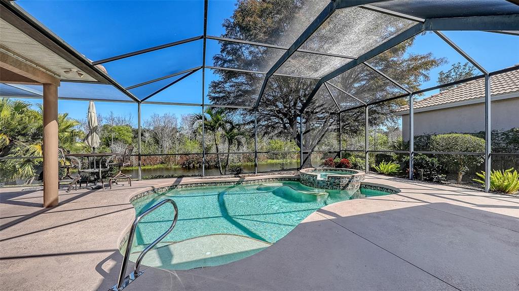 664 Crane Prairie Way Osprey, FL 34229 - Photo 48 of 69 a view of a chairs and table in patio