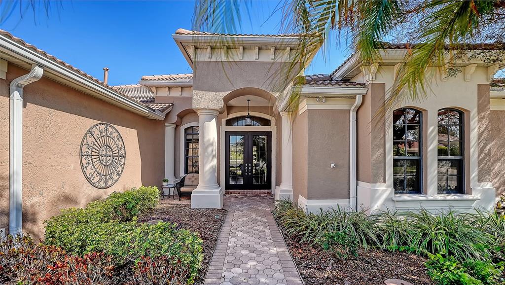 664 Crane Prairie Way Osprey, FL 34229 - Photo 5 of 69 a front view of a house with garden