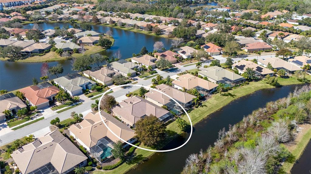 664 Crane Prairie Way Osprey, FL 34229 - Photo 57 of 69 an aerial view of a house with a lake view