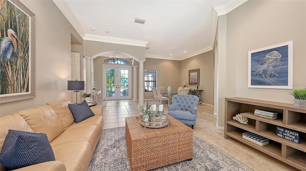 664 Crane Prairie Way Osprey, FL 34229 - Photo 6 of 69 a living room with furniture and wooden floor