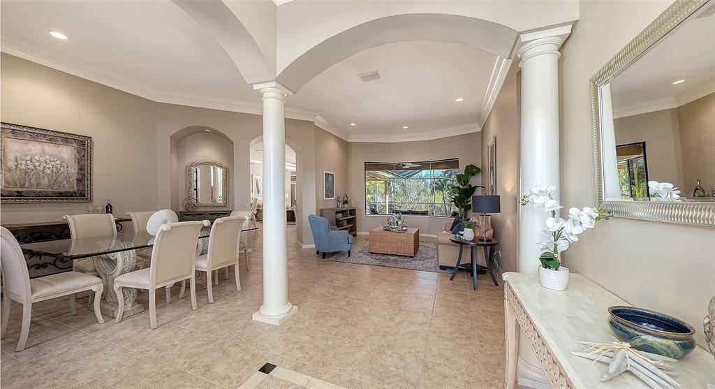 664 Crane Prairie Way Osprey, FL 34229 - Photo 7 of 69 a living room with furniture and a large window