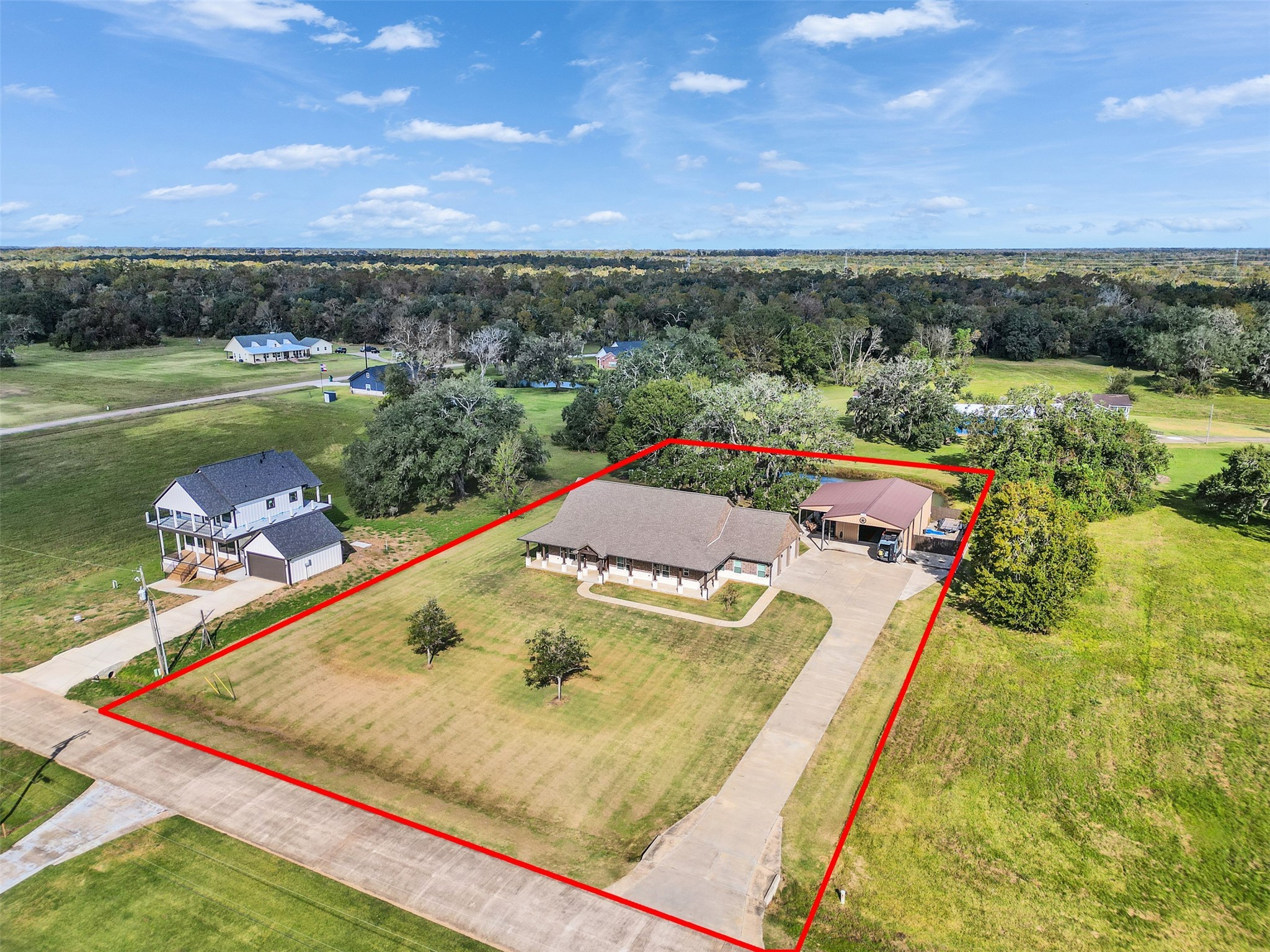 an aerial view of a house with a swimming pool