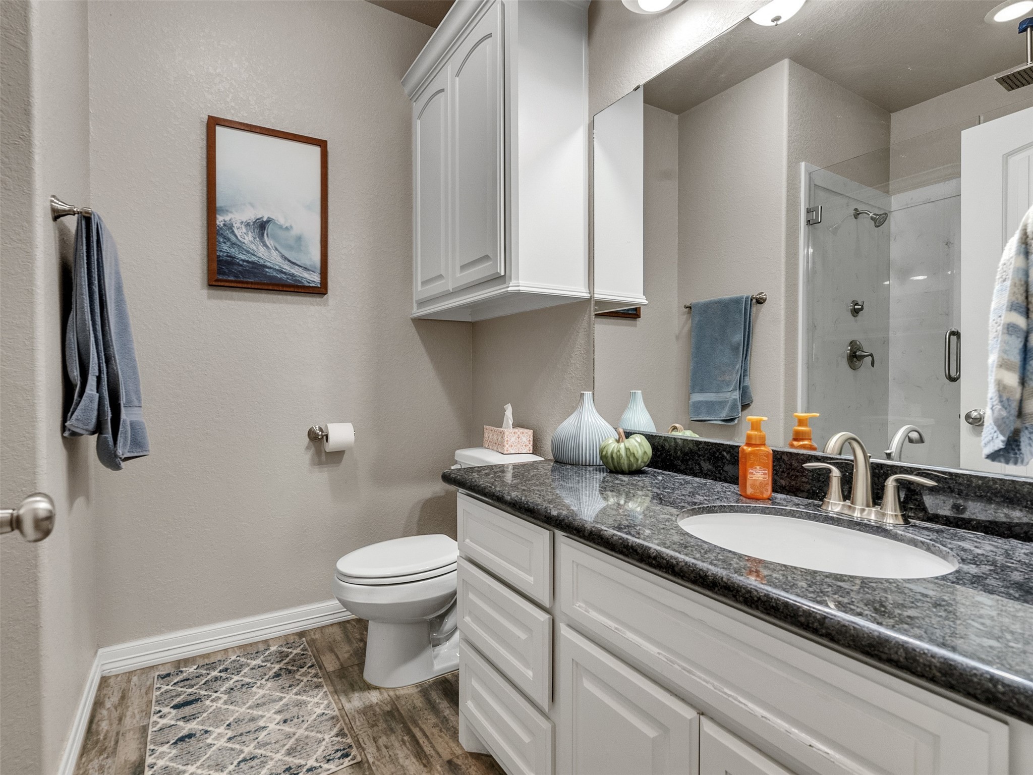 155 Horse Shoe Trail Angleton, TX 77515 - Photo 14 of 29 a bathroom with a granite countertop toilet sink and mirror