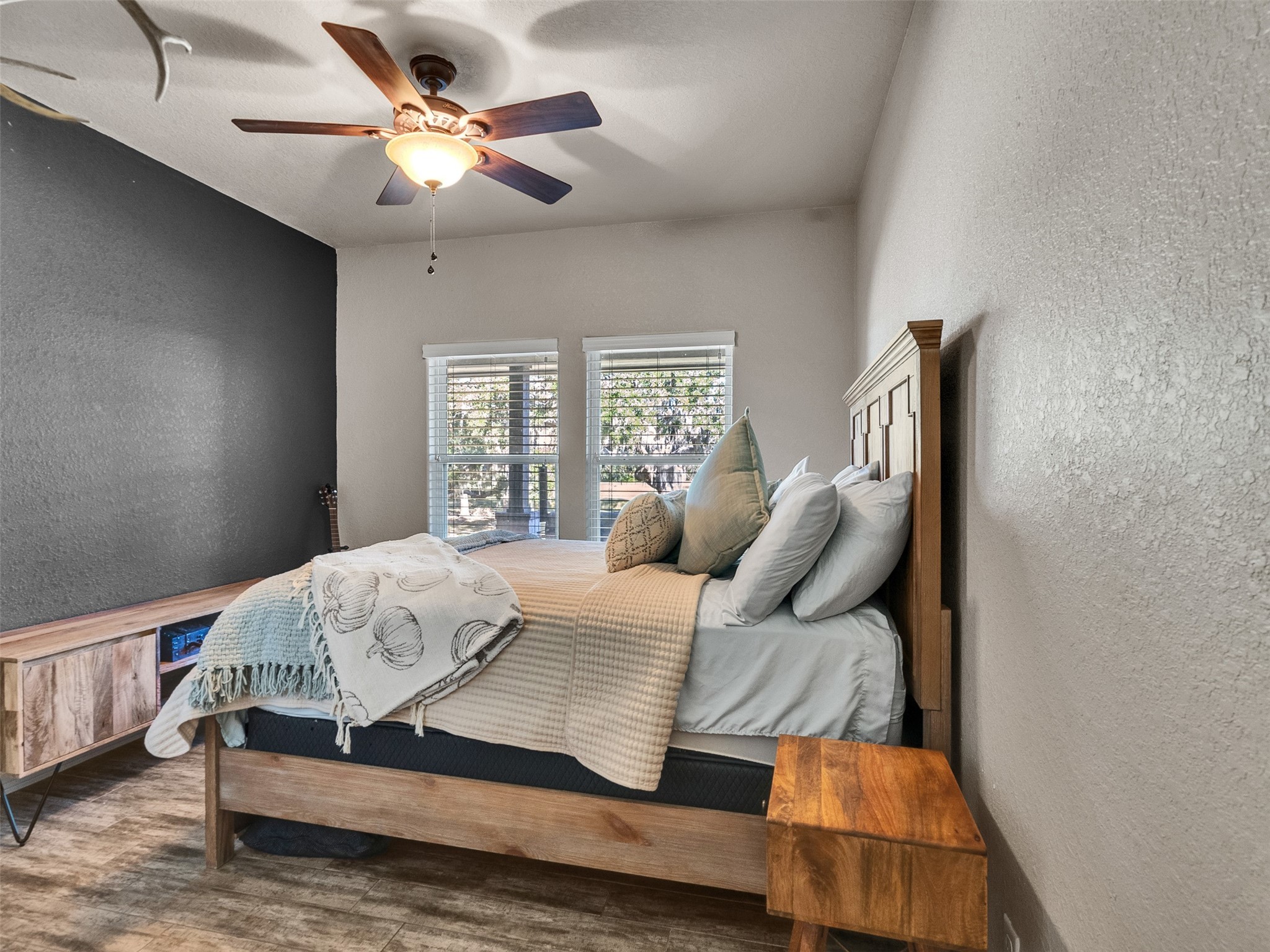 155 Horse Shoe Trail Angleton, TX 77515 - Photo 15 of 29 a bedroom with a large bed chandelier and a window