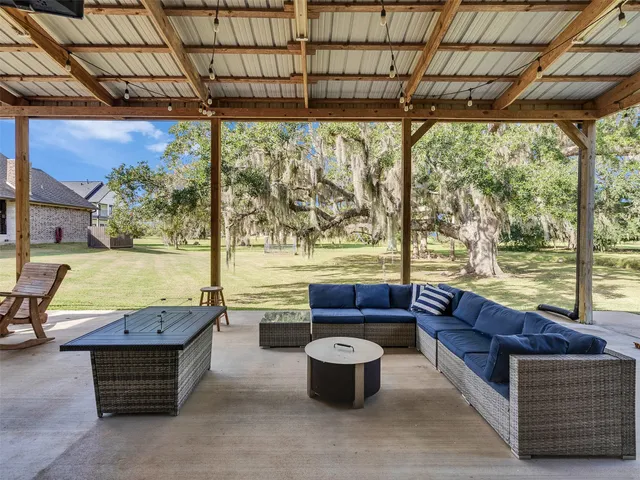 a living room with a large window and a table
