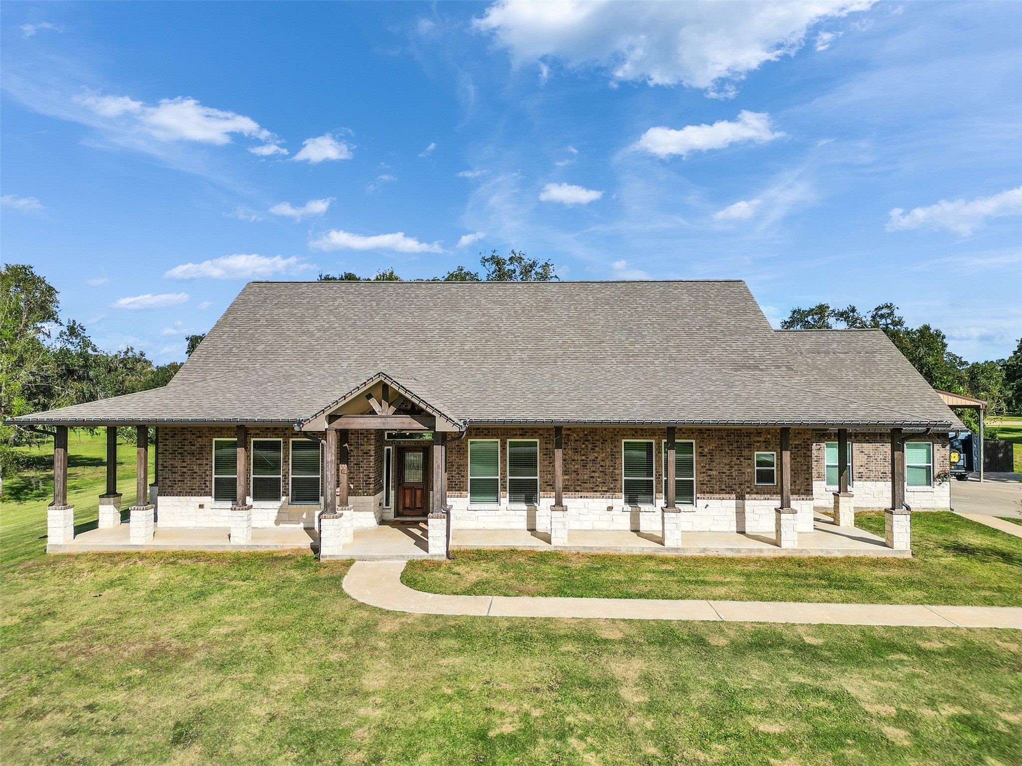 155 Horse Shoe Trail Angleton, TX 77515 - Photo 4 of 29 a front view of a house with a garden