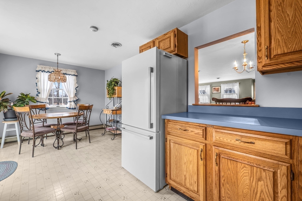 38 High Street, Unit 8 Hanson, MA 02341 - Photo 12 of 37 a kitchen with stainless steel appliances a refrigerator and cabinets