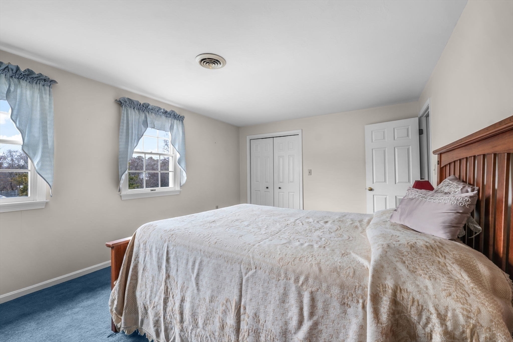 38 High Street, Unit 8 Hanson, MA 02341 - Photo 23 of 37 a bedroom with a bed and a window