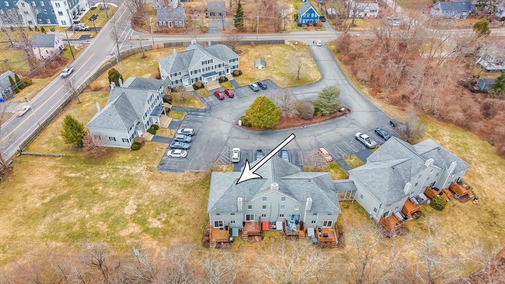 38 High Street, Unit 8 Hanson, MA 02341 - Photo 31 of 37 an aerial view of a house with swimming pool