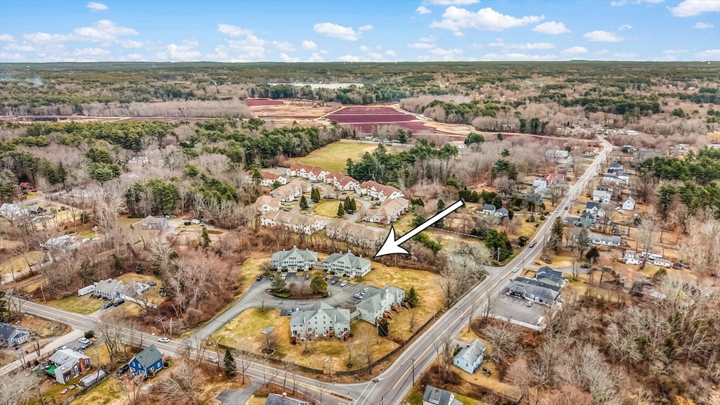 38 High Street, Unit 8 Hanson, MA 02341 - Photo 32 of 37 an aerial view of residential houses with outdoor space