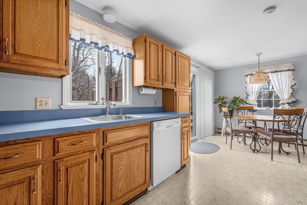 38 High Street, Unit 8 Hanson, MA 02341 - Photo 4 of 37 a kitchen with stainless steel appliances granite countertop a sink and cabinets