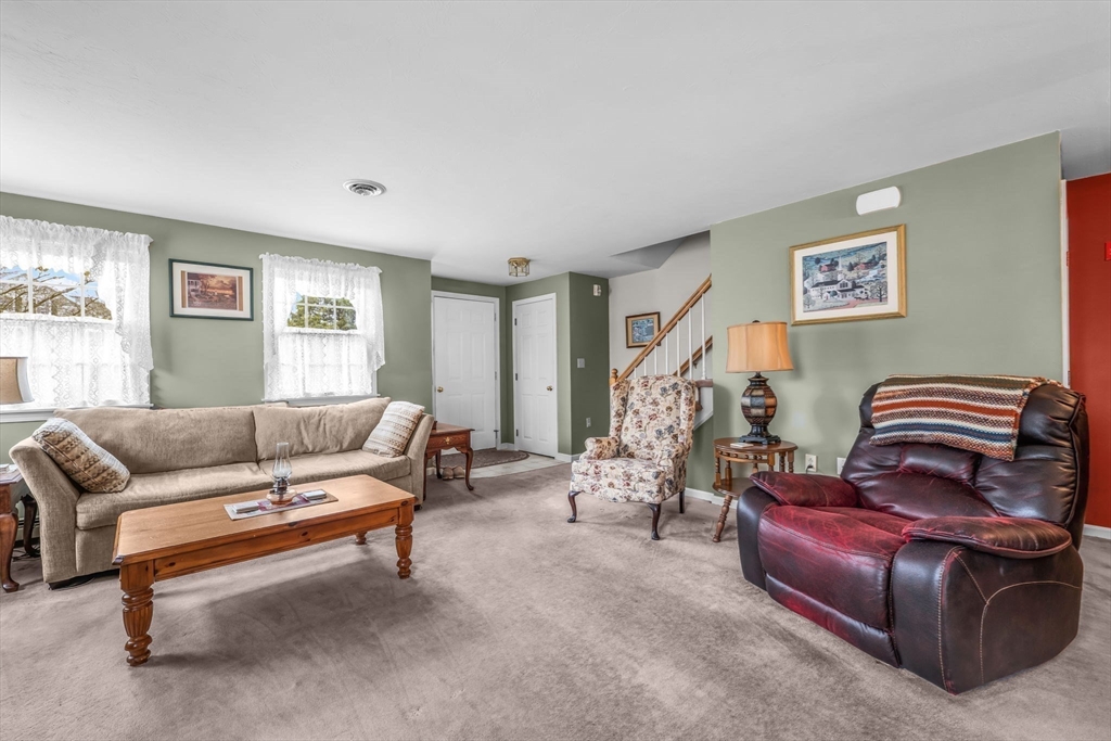 38 High Street, Unit 8 Hanson, MA 02341 - Photo 8 of 37 a living room with furniture and a window