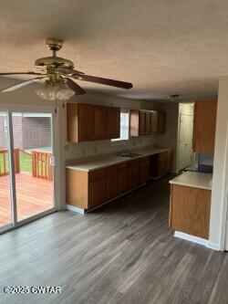 300 Archibald Road Stanton, TN 38069 - Photo 9 of 22 a living room with stainless steel appliances kitchen island granite countertop a rug a stove and a wooden floors