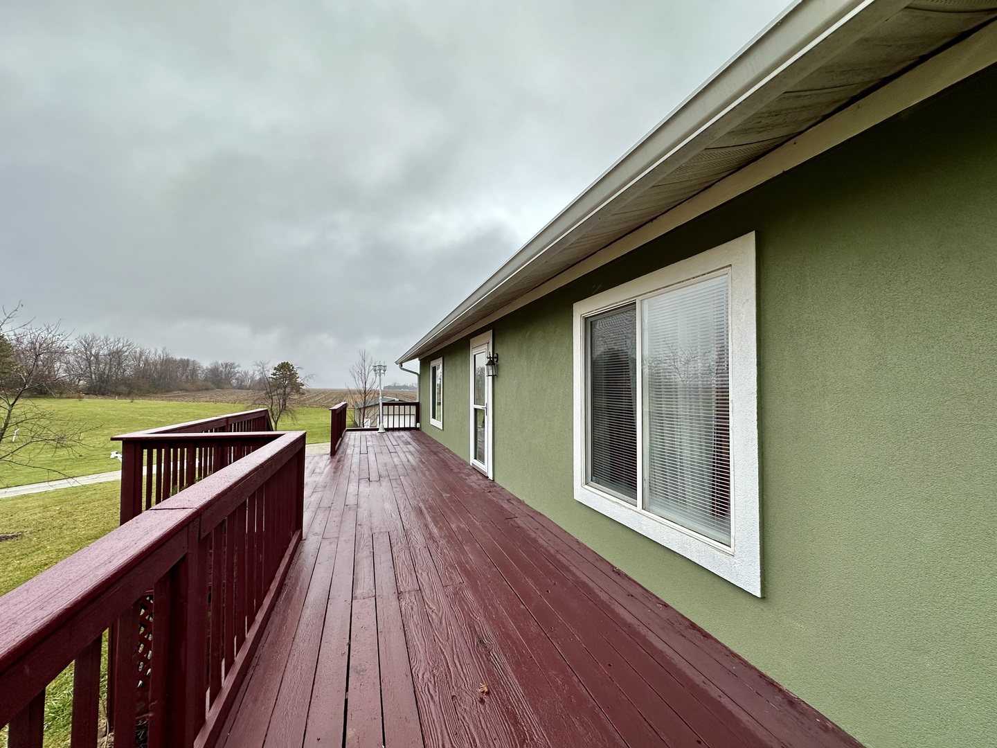 8843 Sunset Road Clinton, IL 61727 - Photo 3 of 32 a view of balcony and deck with wooden floor