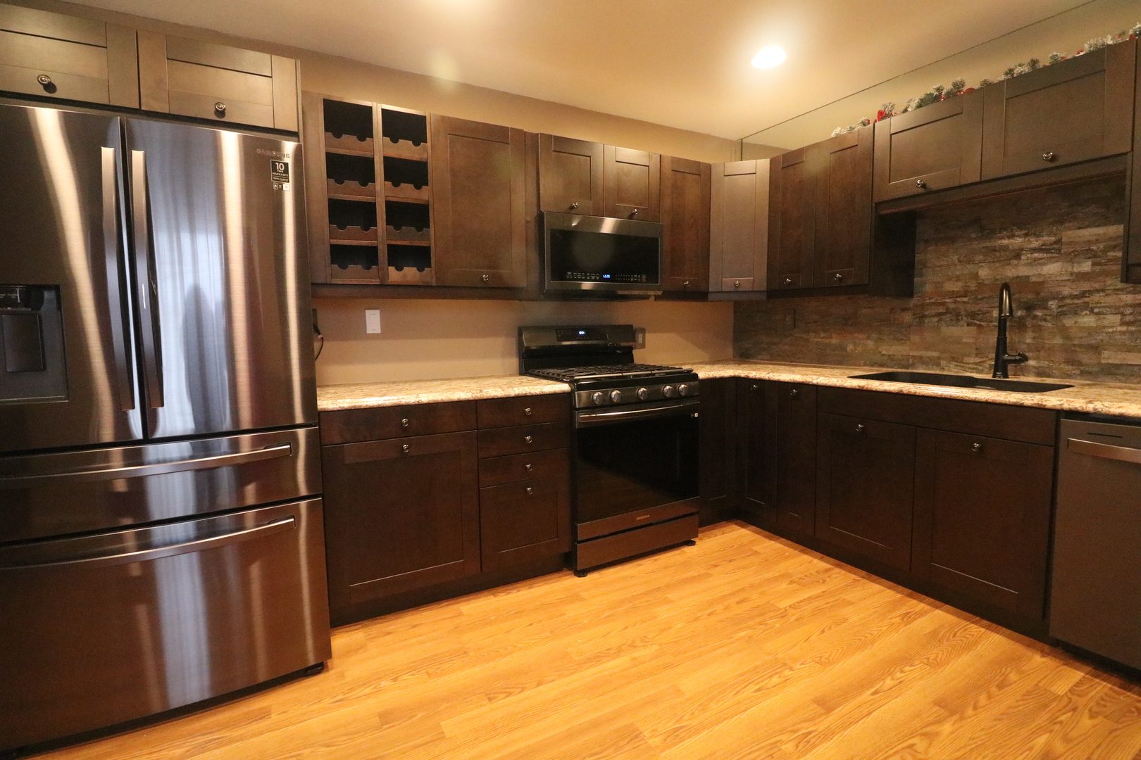8843 Sunset Road Clinton, IL 61727 - Photo 8 of 32 a kitchen with stainless steel appliances granite countertop a refrigerator a sink and a stove