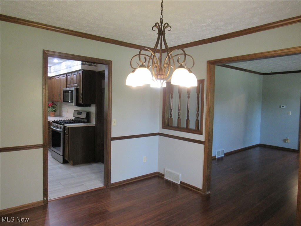1120 Vincent Road Southeast North Canton, OH 44720 - Photo 15 of 50 View from Dining Room into Living Room and Kitchen