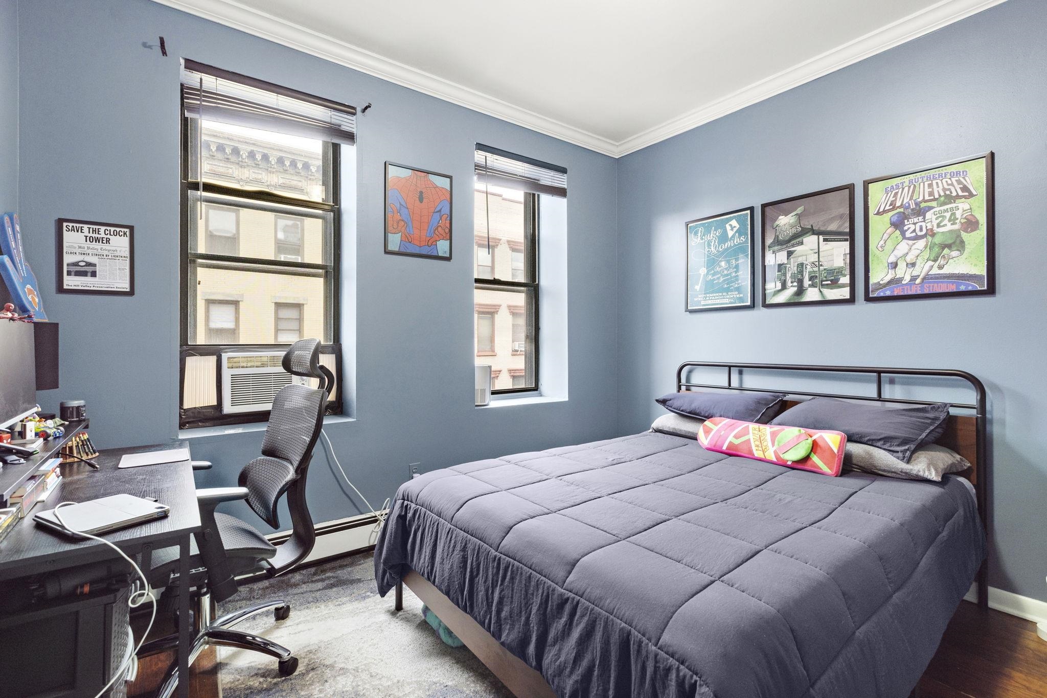 263 1st Street, Unit 4R Hoboken, NJ 07030 - Photo 7 of 11 a bedroom with a bed and wooden floor