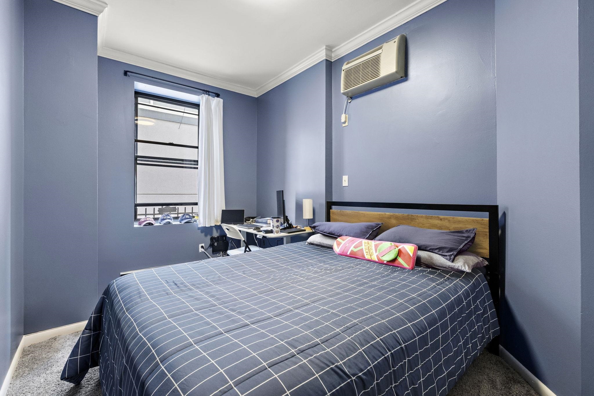 263 1st Street, Unit 4R Hoboken, NJ 07030 - Photo 9 of 11 a bedroom with a bed and a window