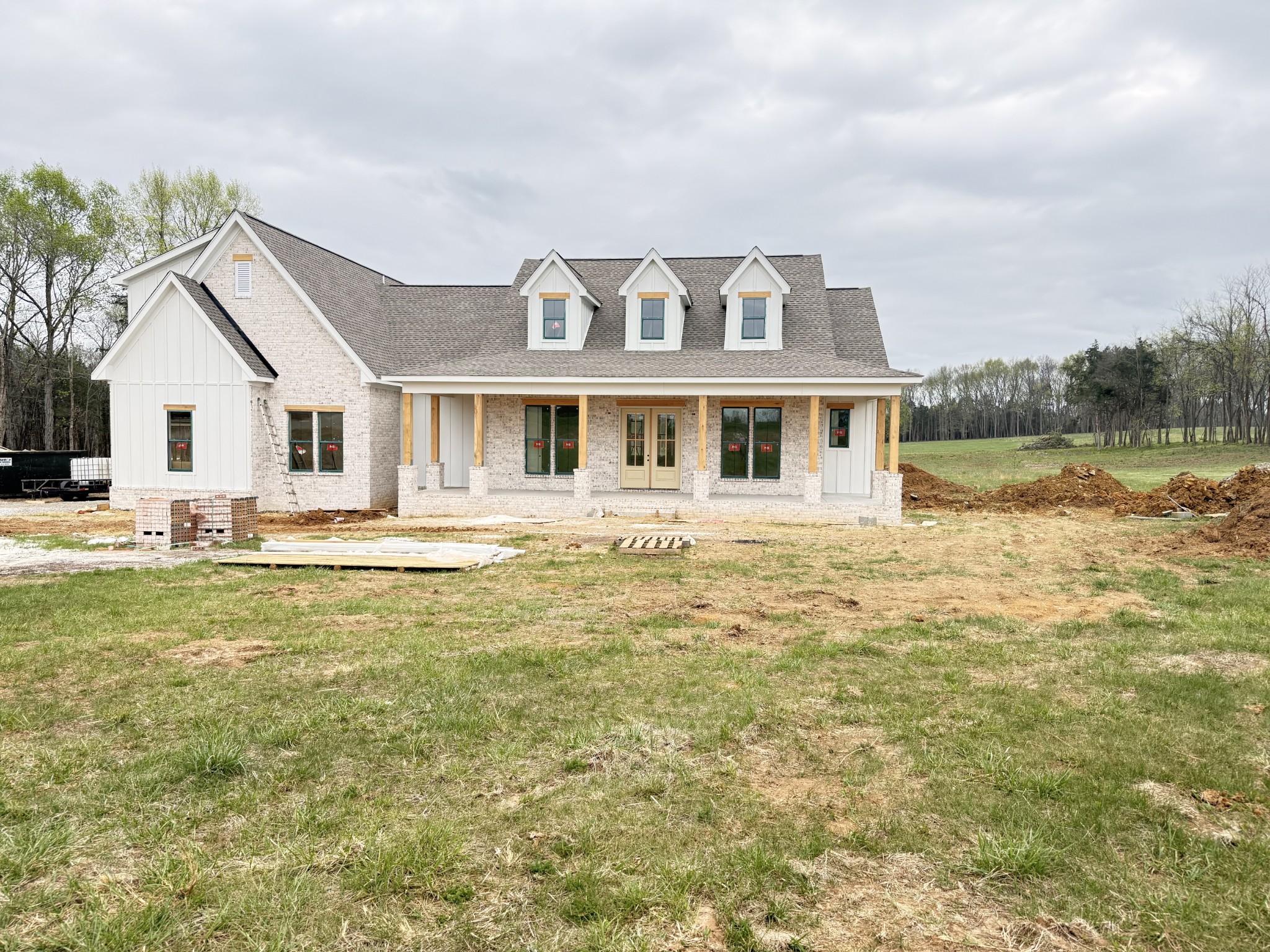 a front view of a house with swimming pool having outdoor seating