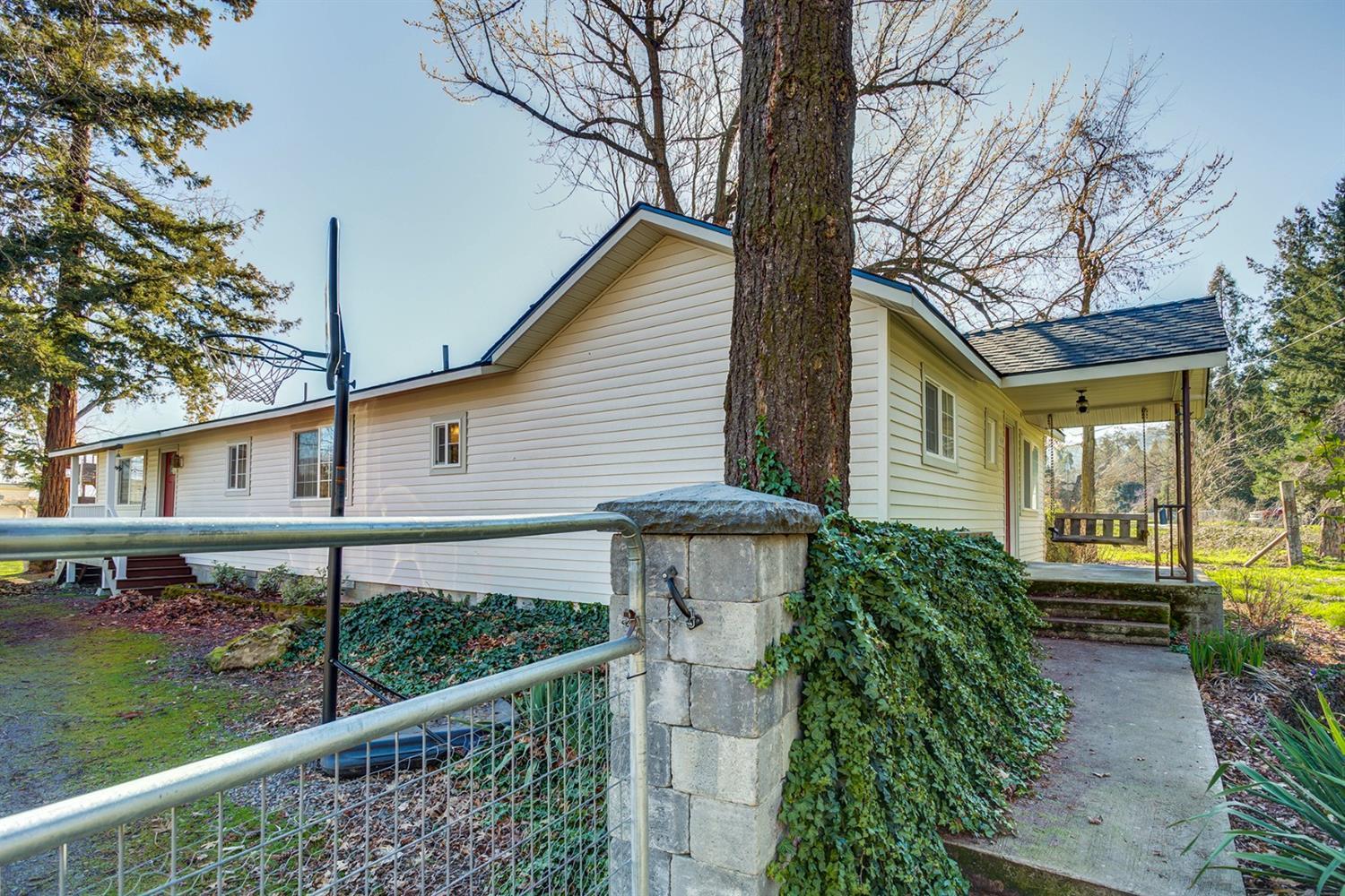 4149 Hilsinger Road Phoenix, OR 97535 - Photo 35 of 35 a view of a house with a small yard and a large tree