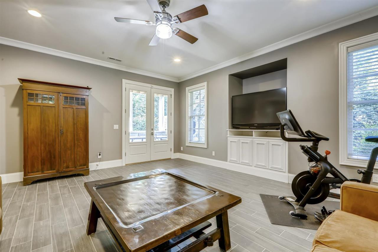 2827 Lewis Farm Road Raleigh, NC 27607 - Photo 17 of 30 Room for Lounging, Exercising, Crafting, Gaming - you name it - access the Patio from the Double French Doors. Rec Room