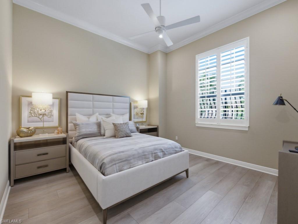 28511 Calabria Court, Unit 202 Naples, FL 34110 - Photo 18 of 44 a bedroom with a bed and a window