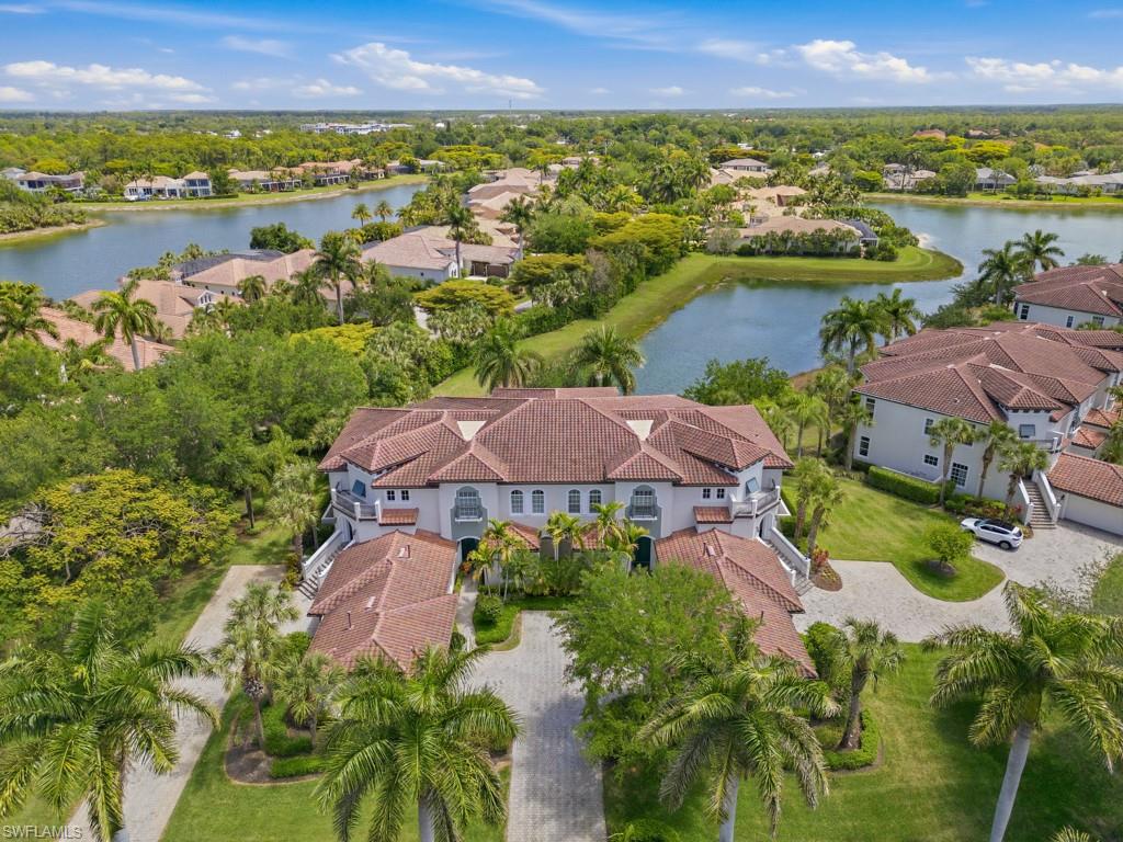 28511 Calabria Court, Unit 202 Naples, FL 34110 - Photo 2 of 44 an aerial view of ocean and residential houses with outdoor space