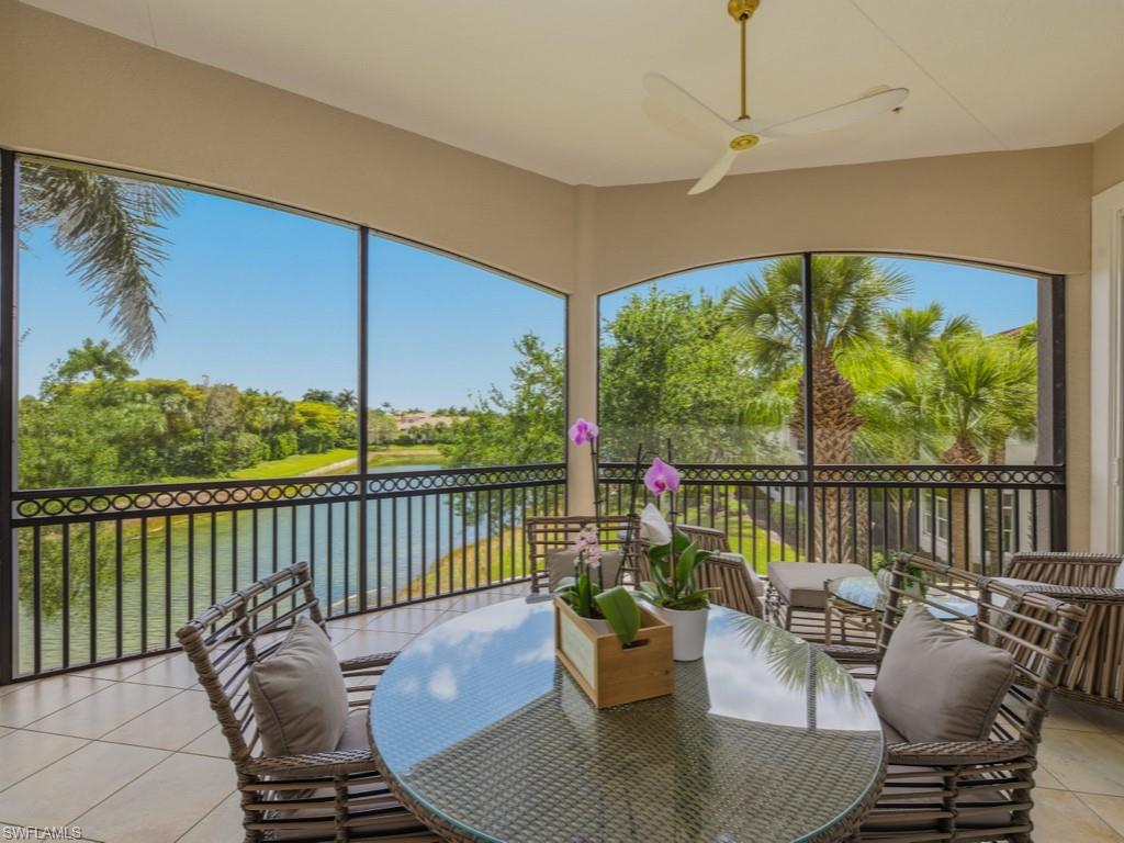 28511 Calabria Court, Unit 202 Naples, FL 34110 - Photo 22 of 44 a balcony with chairs and a table