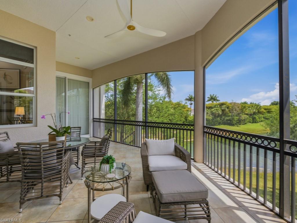 28511 Calabria Court, Unit 202 Naples, FL 34110 - Photo 23 of 44 a outdoor living space with furniture and garden view